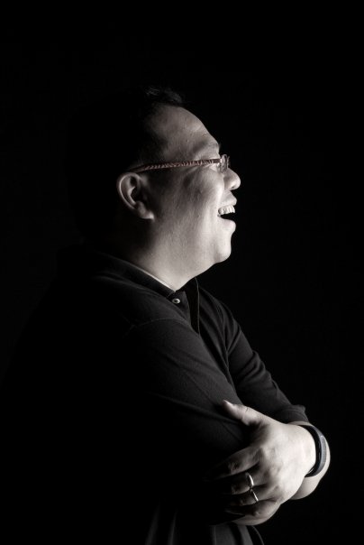 Portrait of Adam Chew — black-and-white side profile